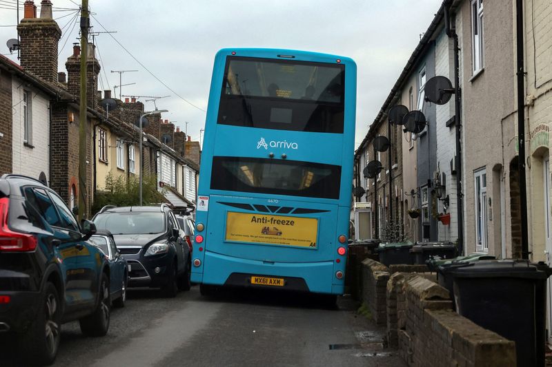 &copy; Reuters. FILE PHOTO: An Arriva bus makes its way down a narrow street near Wouldham, Britain, December 20, 2021.    REUTERS/Kevin Coombs