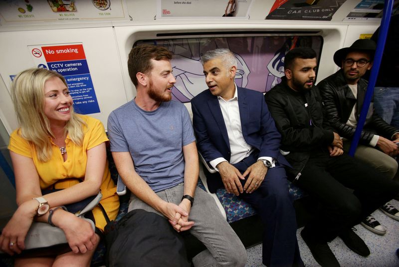 &copy; Reuters. FILE PHOTO: Mayor of London Sadiq Khan (centre) travelling with passengers on a northbound Victoria line tube train during the launch of London's Night Tube August 20, 2016. REUTERS/Yui Mok/PA Wire/Pool/