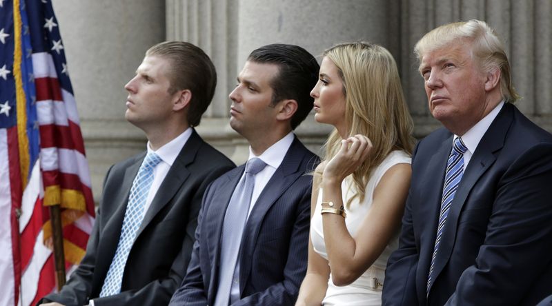 © Reuters. (L-R) Eric Trump, Donald Trump Jr., and Ivanka Trump and Donald Trump attend the ground breaking of the Trump International Hotel at the Old Post Office Building in Washington, July 2014.    REUTERS/Gary Cameron  