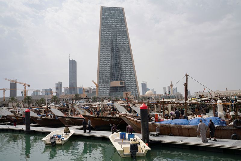 &copy; Reuters. FILE PHOTO: The Kuwait Central Bank towers are pictured over the traditional Dhow harbor as business deals and institutional lending for Gulf have frozen, following an outbreak of coronavirus disease (COVID-19), in Kuwait City, Kuwait March 18, 2020. REUT