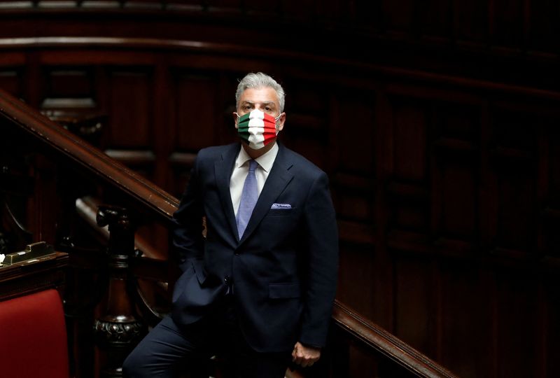 &copy; Reuters. FILE PHOTO: Brothers of Italy party member Federico Mollicone is seen wearing a face mask with the colours of the Italian flag, during a session of the lower house of parliament on the coronavirus disease (COVID-19), in Rome, Italy April 21, 2020. REUTERS