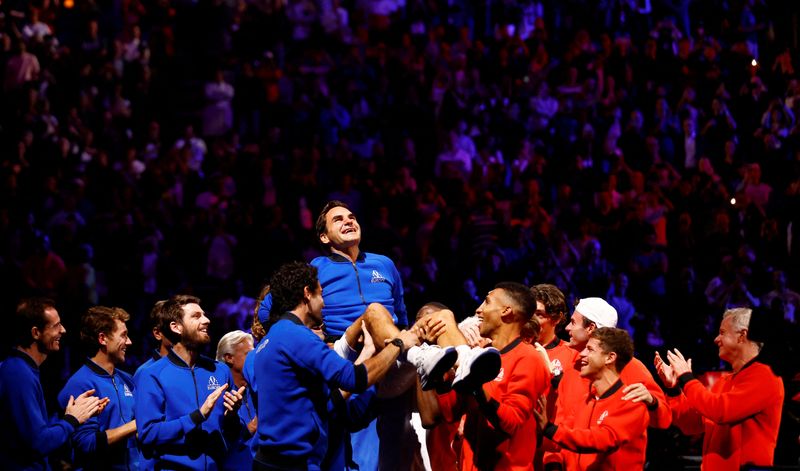&copy; Reuters. Tennis - Laver Cup - 02 Arena, London, Britain - September 24, 2022  Team Europe and World members lift Roger Federer at the end of his last match after announcing his retirement Action Images via Reuters/Andrew Boyers