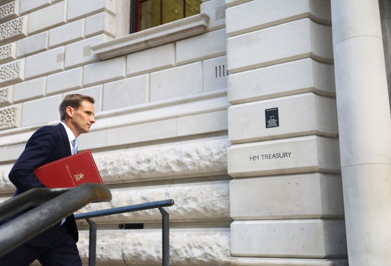 © Reuters. Chief Secretary to the Treasury Chris Philp walks outside Treasury building, in London, Britain September 7, 2022. REUTERS/Hannah Mckay