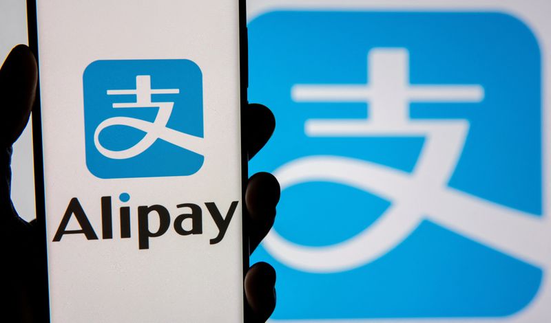 &copy; Reuters. FILE PHOTO: The Alipay logo is seen on the screen of a smartphone, held up in front of a display of the same logo, in this illustration taken September 14, 2021. REUTERS/Dado Ruvic/Illustration/