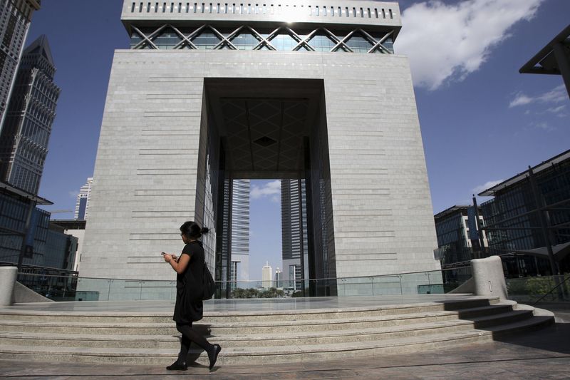 &copy; Reuters. FILE PHOTO: A woman walks near The Gate building at the financial and business district Dubai International Financial Center in Dubai February 5, 2012. REUTERS/Nikhil Monteiro (UNITED ARAB EMIRATES - Tags: BUSINESS)
