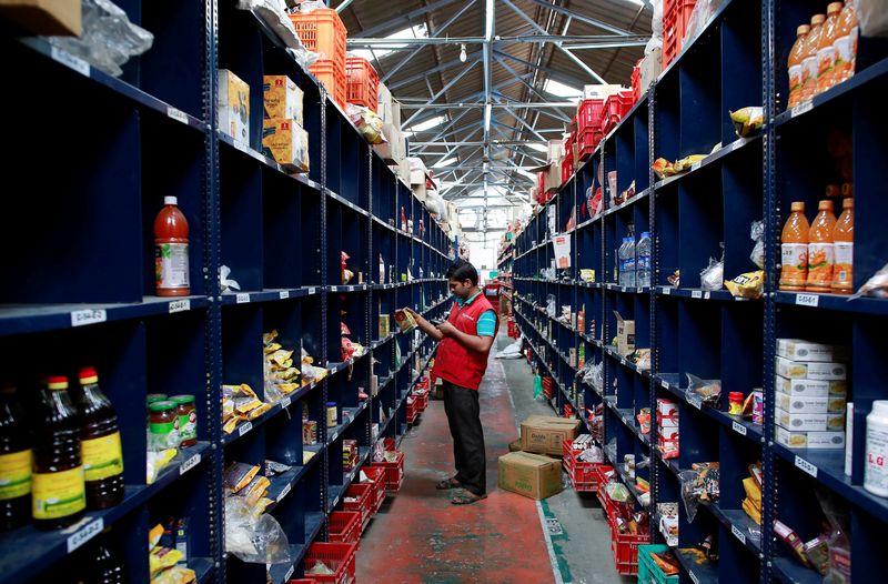 &copy; Reuters. FILE PHOTO: An employee scans a package for an order at a BigBasket warehouse on the outskirts of Mumbai November 4, 2014. REUTERS/Danish Siddiqui/