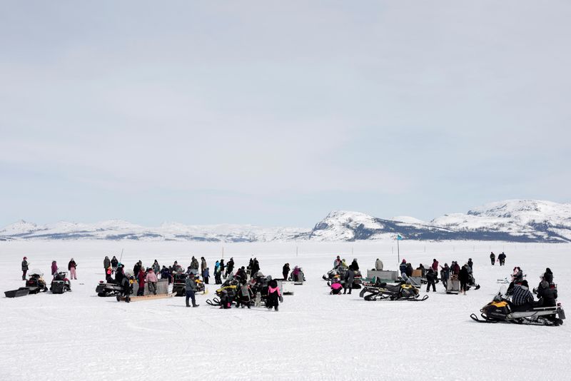 &copy; Reuters. Nain's community members gather to watch and participate in the Easter Games, at the harbour in Nain, Newfoundland and Labrador, Canada, April 19, 2022. The Easter Games is an annual week-long event held in Nain that brings the community together to parti