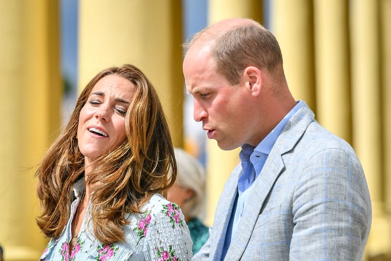 &copy; Reuters. FILE PHOTO: Britain's Prince William and Catherine, Duchess of Cambridge walk on the promenade as they visit beach huts during their visit to Barry Island, South Wales, amid the coronavirus disease (COVID-19) outbreak, Britain August 5, 2020. Ben Birchall