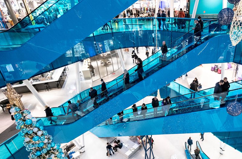 &copy; Reuters. FILE PHOTO: Christmas shoppers maintain social distancing as they ride on escalators in Emporia shopping centre in Malmo, Sweden, December 20, 2020. TT News Agency/Johan Nilsson via REUTERS      ATTENTION EDITORS - THIS IMAGE WAS PROVIDED BY A THIRD PARTY