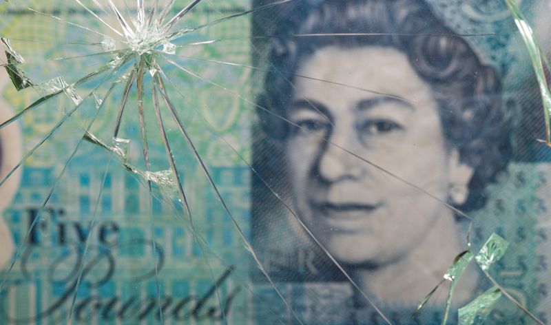 &copy; Reuters. British pound banknote is pictured through broken glass in this illustration taken, June 25, 2021. REUTERS/Dado Ruvic/Illustration