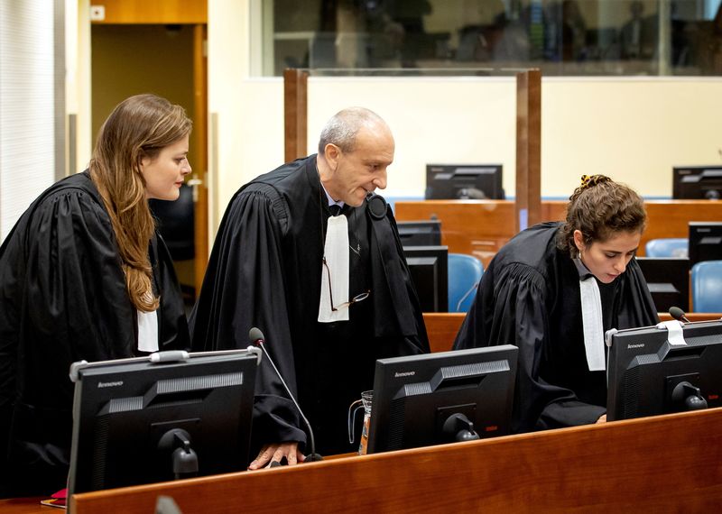 &copy; Reuters. THE HAGUE - Defence lawyer Emmanuel Altit (C) of Felicien Kabuga in court at the UN International Residual Mechanism for Criminal Tribunals (IRMCT) in The Hague. KOEN VAN WEEL/Pool via REUTERS