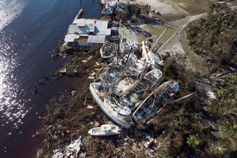 &copy; Reuters. Stranded shrimp boats are seen in a marina after Hurricane Ian caused widespread destruction in Fort Myers Beach, Florida, U.S., September 30, 2022. REUTERS/Marco Bello