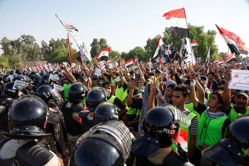 Tear gas fired, scores wounded in Baghdad protest marking 2019 unrest