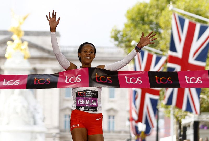 &copy; Reuters. Athletics - London Marathon - London, Britain - October 2, 2022 Ethiopia's Yalemzerf Yehualaw crosses the line to win the women's elite race Action Images via Reuters/Andrew Boyers