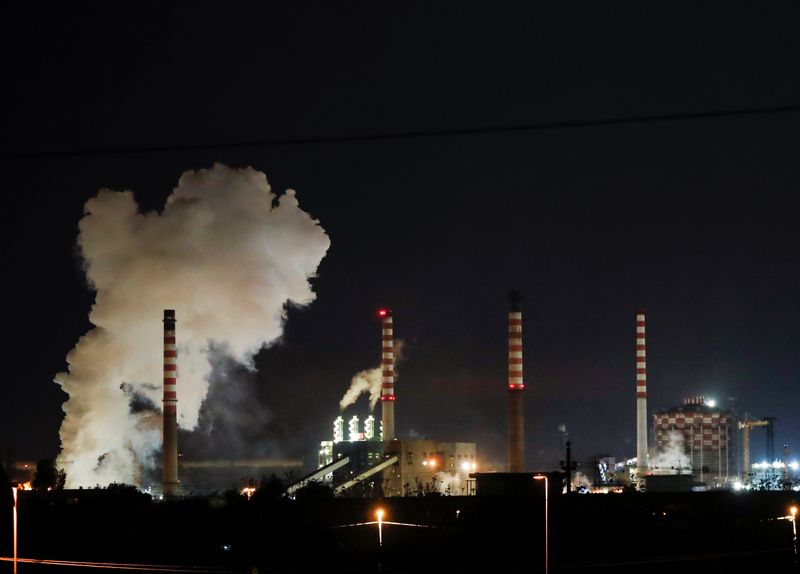 &copy; Reuters. FILE PHOTO: Steam comes out of the chimneys of Ilva steel plant in Taranto, Italy, November 9, 2019. REUTERS/Ciro De Luca