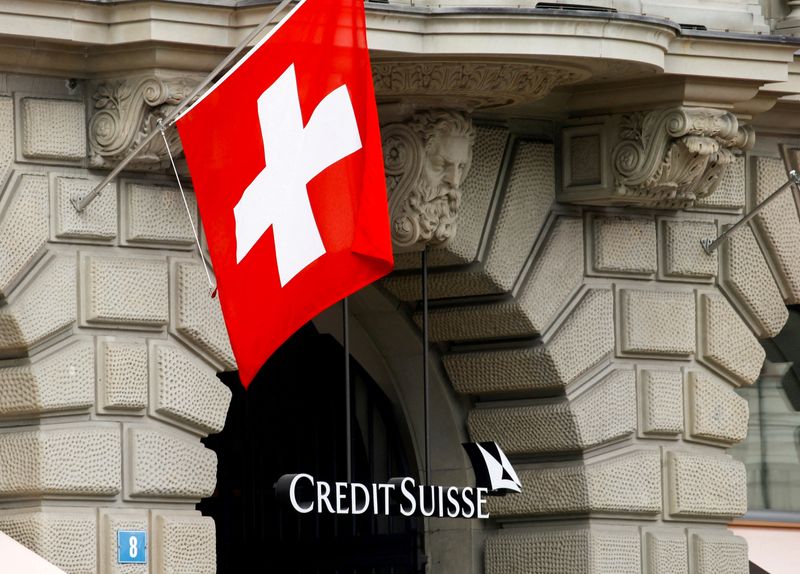 &copy; Reuters. FILE PHOTO: Switzerland's national flag flies above the logo of Swiss bank Credit Suisse at its headquarters in Zurich, Switzerland April 18, 2021. REUTERS/Arnd Wiegmann/File Photo