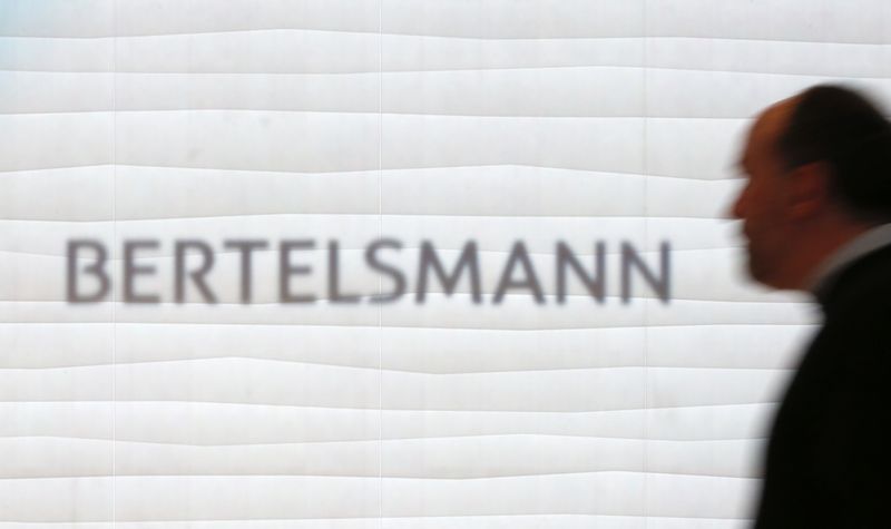 &copy; Reuters. FILE PHOTO: A man is silhouetted in front of the logo of German media group Bertelsmann prior to the annual news conference in Berlin, Germany, March 22, 2016. REUTERS/Fabrizio Bensch/File Photo
