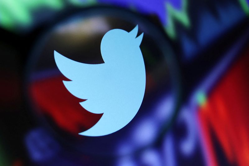 &copy; Reuters. Twitter logo and stock graph are seen through a magnifier displayed in this illustration taken September 4, 2022. REUTERS/Dado Ruvic/Illustration