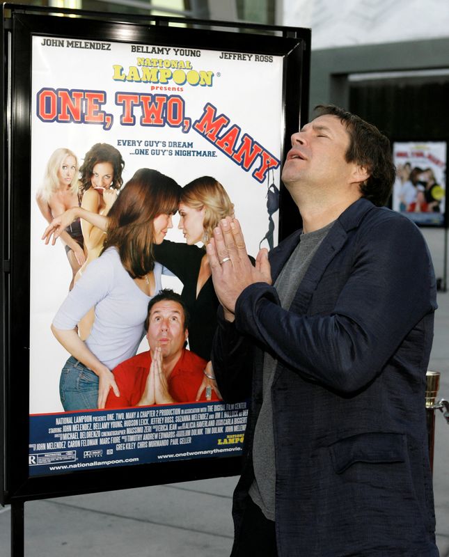 © Reuters. FILE PHOTO: Cast member John Melendez pretends to pray as he arrives for the premiere of 