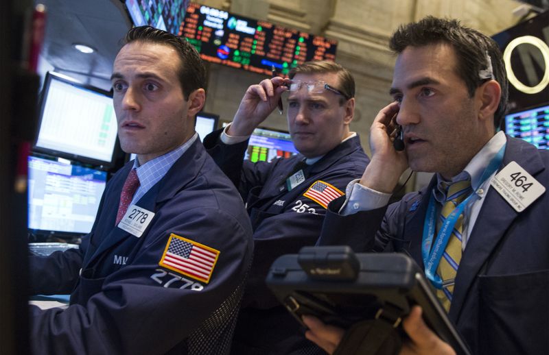 &copy; Reuters. Des traders travaillent à la Bourse de New York. /Photo prise le 4 mars 2014/REUTERS/Brendan McDermid