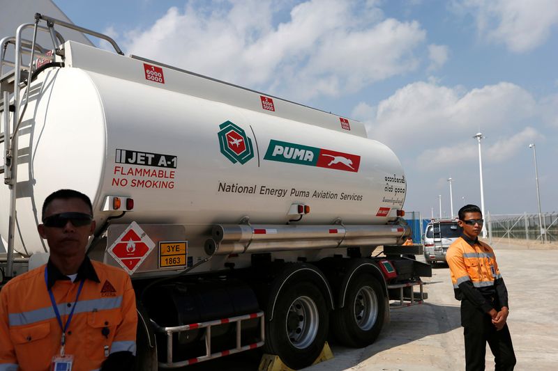 &copy; Reuters. FILE PHOTO: Security guards stand near a tanker carrying aviation fuel during the opening ceremony of Puma Energy fuel storage facility at Myanmar International Terminal Thilawa outside Yangon, Myanmar May 6, 2017. REUTERS/Soe Zeya Tun/File Photo