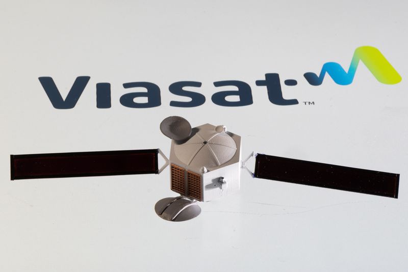 &copy; Reuters. Satellite model is placed on Viasat logo in this picture illustration taken April 4, 2022. REUTERS/Dado Ruvic/Illustration