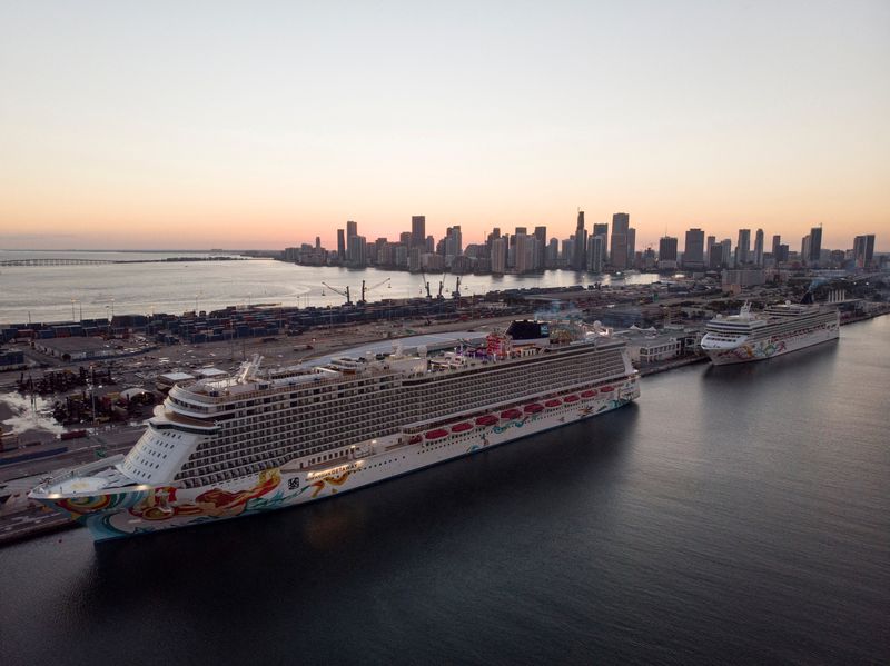 &copy; Reuters. FILE PHOTO: The Norwegian Getaway and the Norwegian Pearl cruise ships are seen docked at Miami port in Miami, Florida, U.S. January 5, 2022. Picture taken with a drone. REUTERS/Marco Bello/File Photo