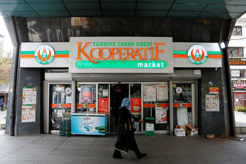 &copy; Reuters. A woman walks past a grocery shop of the Agricultural Credit Cooperatives of Turkey in Ankara, Turkey October 18, 2021. Picture taken October 18, 2021. REUTERS/Cagla Gurdogan