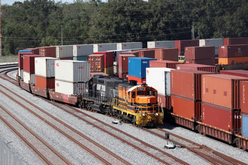 &copy; Reuters. FILE PHOTO: A commercial freight train carries a load of shipping containers at the Port of Savannah, Georgia, U.S. October 17, 2021.  REUTERS/Octavio Jones/File Photo