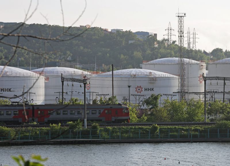 &copy; Reuters. A train moves past oil tanks of the NNK-Primornefteproduct petroleum depot in the far eastern port of Vladivostok, Russia June 11, 2022. REUTERS/Tatiana Meel