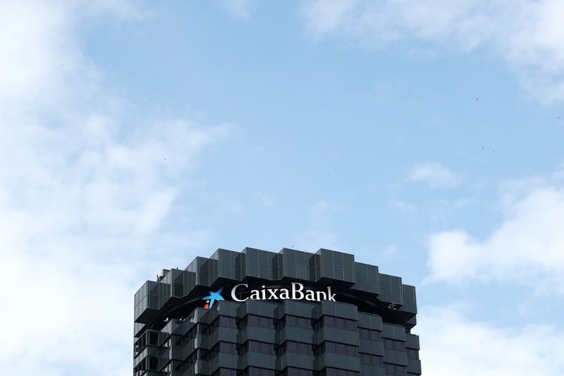 &copy; Reuters. FILE PHOTO: CaixaBank's logo is seen on top of the company's headquarters in Barcelona, Spain, September 17, 2020. REUTERS/Albert Gea
