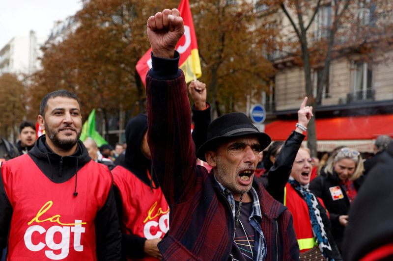 &copy; Reuters. FILE PHOTO: Protestors and French CGT labour union workers attend a demonstration as part of a nationwide day of strike and protests to push for government measures to address inflation, workers' rights and pension reforms, in Paris, France, September 29,