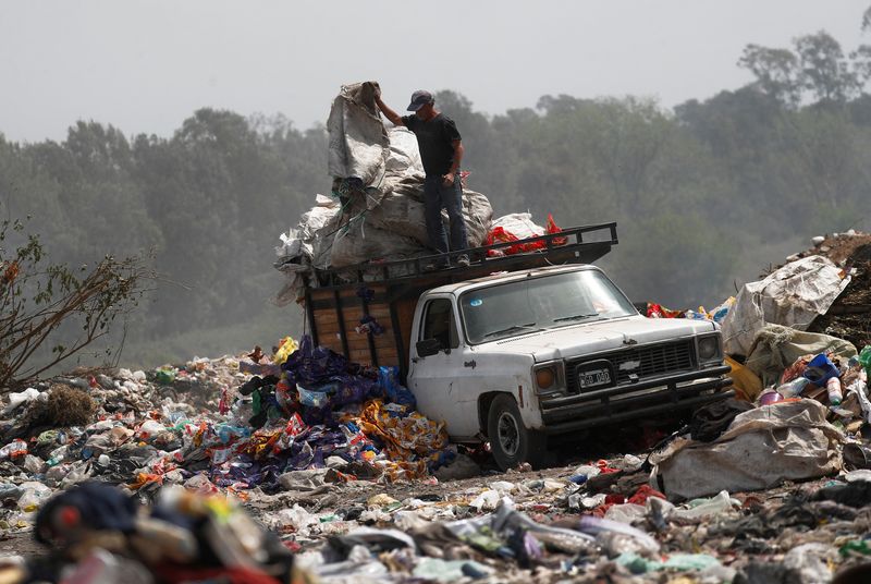 Turning to garbage dumps to survive, Argentines feel the pain of 100% inflation