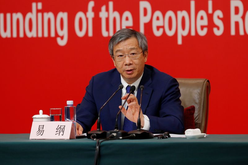 &copy; Reuters. FILE PHOTO: Governor of People's Bank of China (PBOC) Yi Gang attends a news conference on China's economic development ahead of the 70th anniversary of its founding, in Beijing, China September 24, 2019. REUTERS/Florence Lo