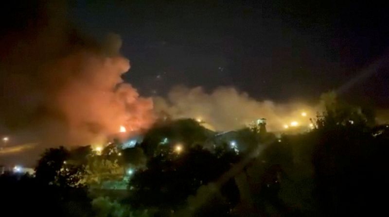 &copy; Reuters. دخان يتصاعد من  سجن إيفين في طهران يوم الأحد. صورة لرويترز من مقطع مصور. (يحظر إعادة بيع أو الاحتفاظ بالصورة في الأرشيف).