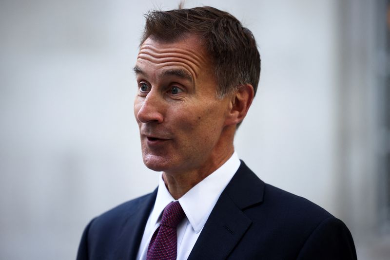 © Reuters. FILE PHOTO - British Chancellor of the Exchequer Jeremy Hunt speaks during an interview with television correspondent Robert Peston outside the BBC headquarters, in London, Britain, October 15, 2022. REUTERS/Henry Nicholls