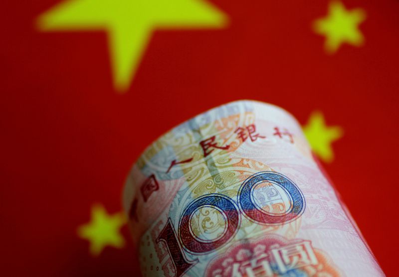 &copy; Reuters. FILE PHOTO: A China yuan note is seen in this illustration photo May 31, 2017.     REUTERS/Thomas White/Illustration