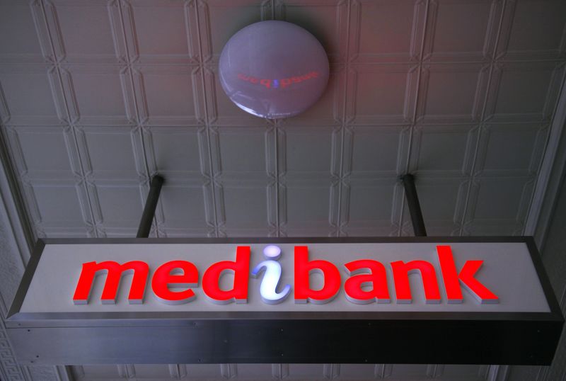 © Reuters. FILE PHOTO: An illuminated sign is seen outside a branch of the Australian health insurer Medibank Private in Sydney October 20, 2014.   REUTERS/David Gray       