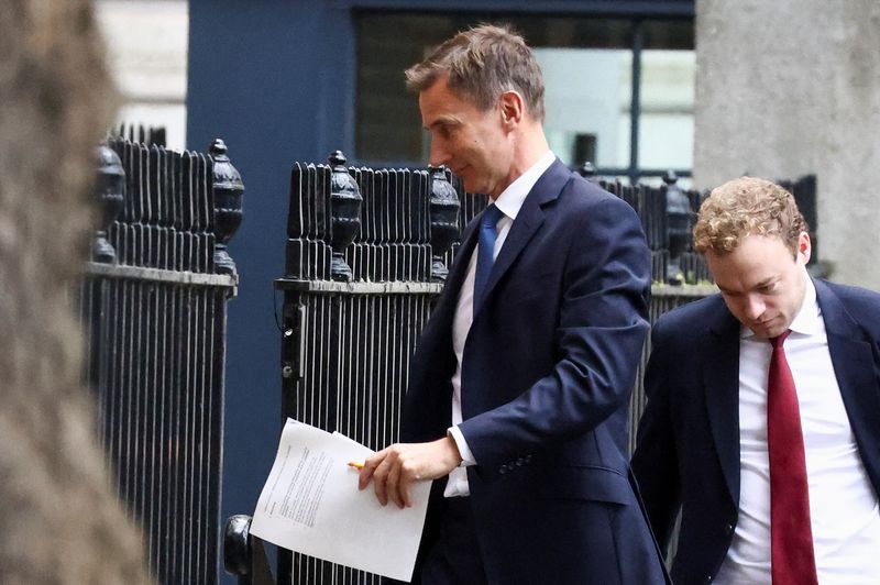 &copy; Reuters. British Chancellor of the Exchequer Jeremy Hunt walks outside Downing Street in London, Britain October 17, 2022. REUTERS/Henry Nicholls