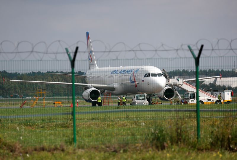 &copy; Reuters. FILE PHOTO: A view through a fence shows a Ural Airlines passenger plane on the tarmac of Zhukovsky International Airport in Moscow Region, Russia August 15, 2019. REUTERS/Maxim Shemetov
