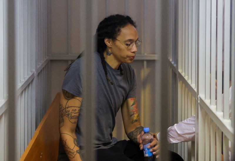 &copy; Reuters. FILE PHOTO: U.S. basketball player Brittney Griner, who was detained at Moscow's Sheremetyevo airport and later charged with illegal possession of cannabis, sits inside a defendants' cage after the court's verdict in Khimki outside Moscow, Russia August 4