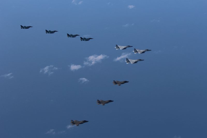 &copy; Reuters. FILE PHOTO: 5th and 8th Air Wing of Japan Air Self-Defense Force's F-15 and F-2 fighters hold a joint military drill with U.S. Marine Aircraft Group 12's F-35B fighters off Japan's southernmost main island of Kyushu, Japan, in this handout picture taken b