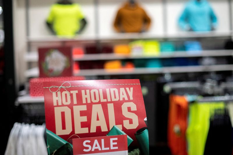 &copy; Reuters. FILE PHOTO: Athletic wear is displayed for sale beside a sign stating "HOT HOLIDAY DEALS SALE" at a Dick's Sporting Goods store in Collegeville, Pennsylvania U.S. November 20, 2020. REUTERS/Mark Makela