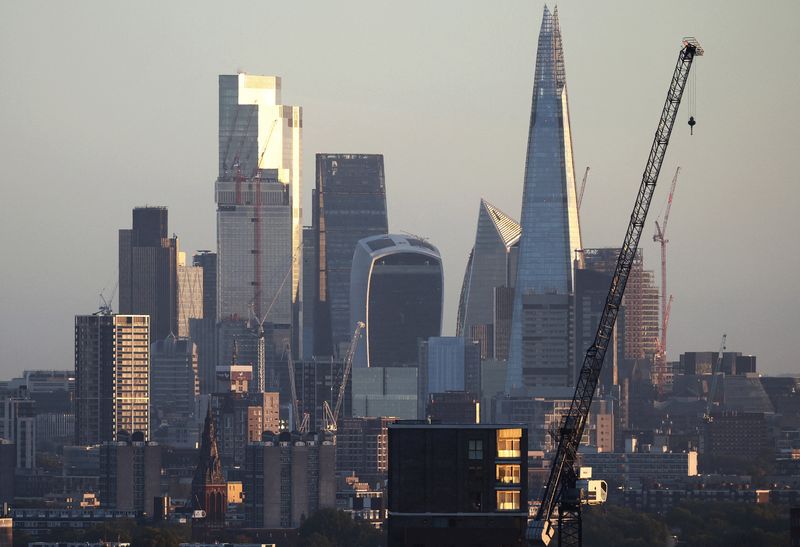 &copy; Reuters. FILE PHOTO: The City of London financial district can be seen in the distance beyond housing developments in London, Britain, October 8, 2022. REUTERS/Henry Nicholls