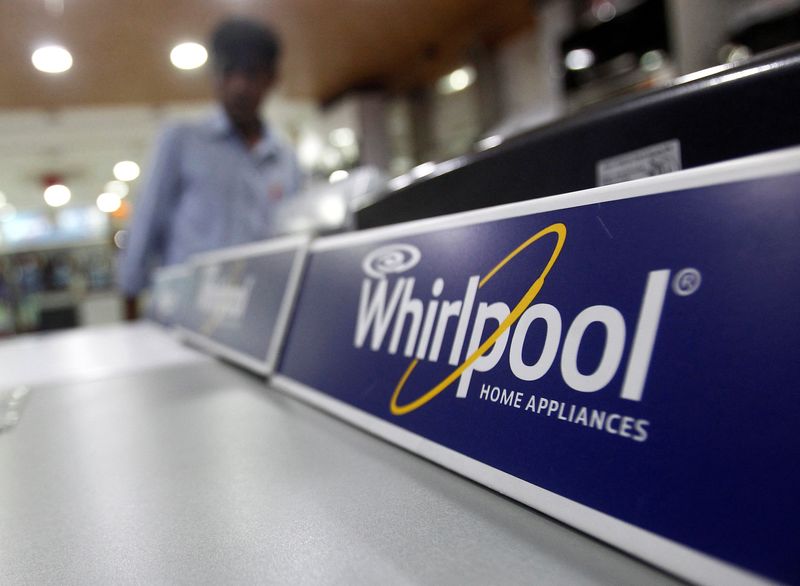 &copy; Reuters. FILE PHOTO: An employee stands next to a Whirlpool washing machine inside a home appliances showroom in New Delhi August 27, 2013. REUTERS/Anindito Mukherjee