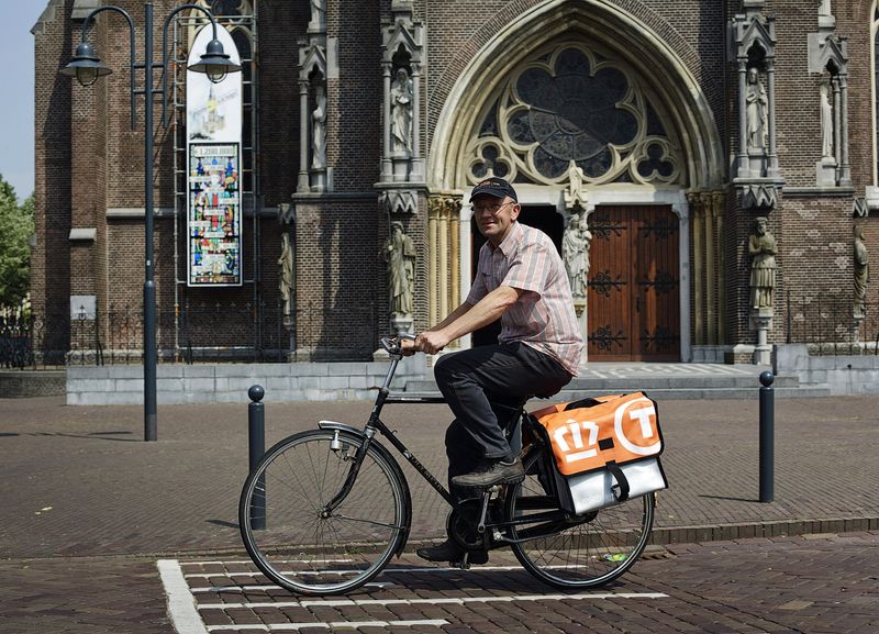 &copy; Reuters. FILE PHOTO: Postnl employee Jaap Bouwmans rides his bicycle to work in his hometown Veghel May 20, 2011. Picture taken May 20. REUTERS/ Jerry Lampen 
