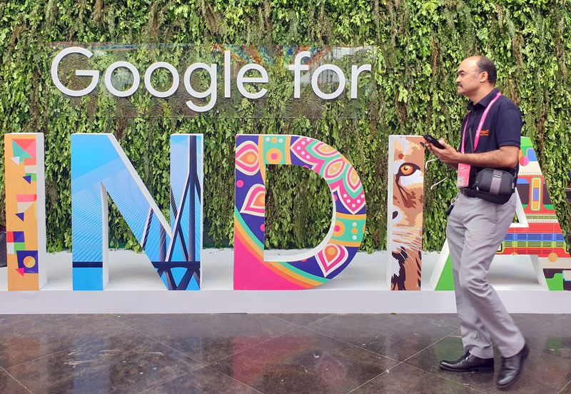 &copy; Reuters. FILE PHOTO: A man walks past the sign of "Google for India", the company's annual technology event in New Delhi, India, September 19, 2019. REUTERS/Sankalp Phartiyal