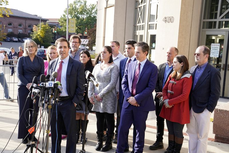 &copy; Reuters. FILE PHOTO: Attorney Chris Mattei addresses the media surrounded by families who lost loved ones during the Sandy Hook Elementary School Shooting, after the jury awarded them $965 million in damages in a second defamation trial against Alex Jones over San