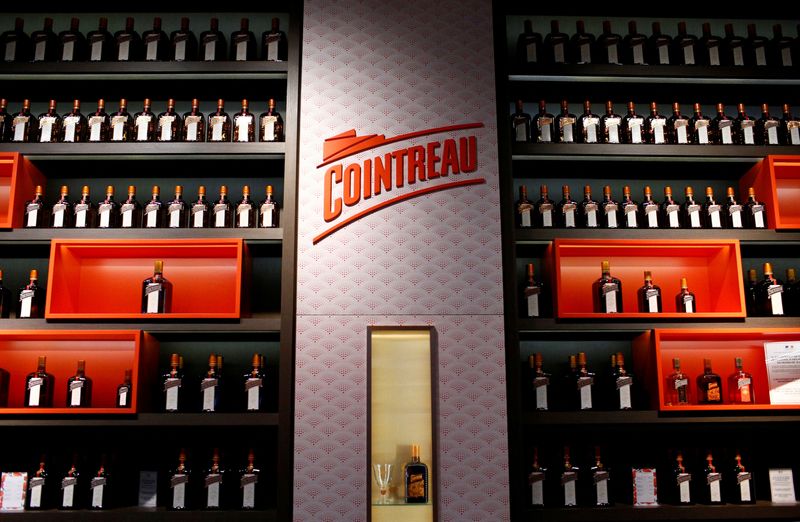 © Reuters. FILE PHOTO: Bottles of Cointreau, the orange-flavoured triple sec liqueur, are displayed in the Carre Cointreau at the Cointreau distillery in Saint-Barthelemy-d'Anjou, near Angers, France, February 8, 2019. REUTERS/Stephane Mahe/File Photo