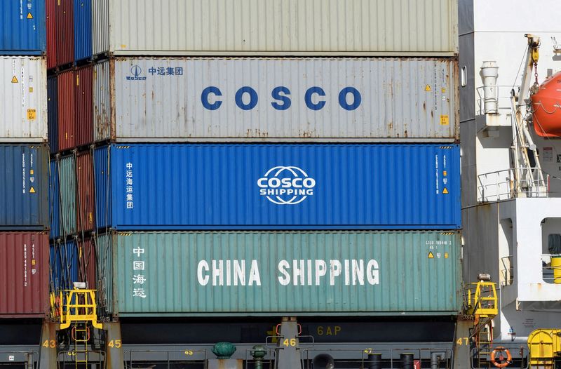 &copy; Reuters. FILE PHOTO: Containers of Chinese companies China Shipping and COSCO (China Ocean Shipping Company) are loaded on a container as it is leaving the port in Hamburg, Germany March 11, 2020. REUTERS/Fabian Bimmer